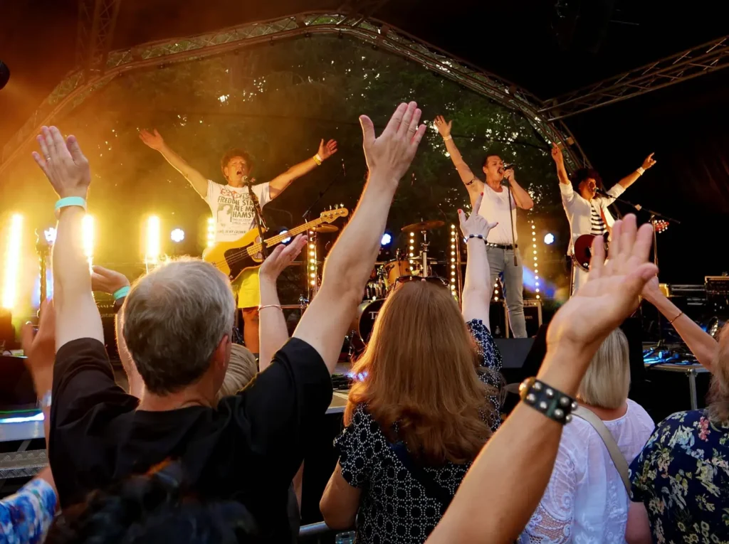 Queen Champions live Queen tribute band engaging with the audience at a festival