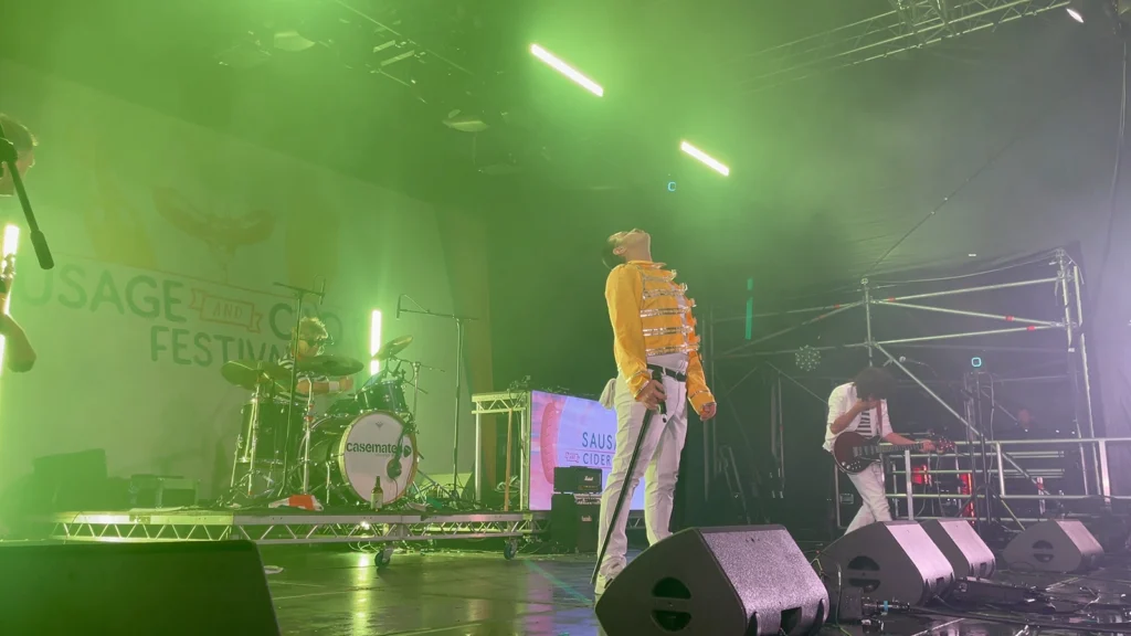 Queen Champions performing live on a festival stage