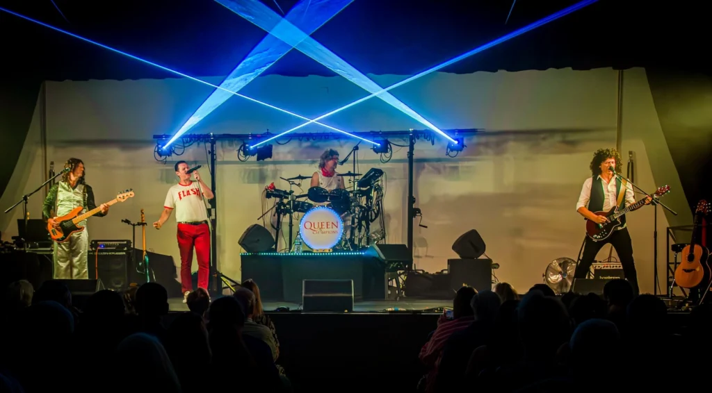 Queen Champions live Queen tribute show with stage lighting and laser effects