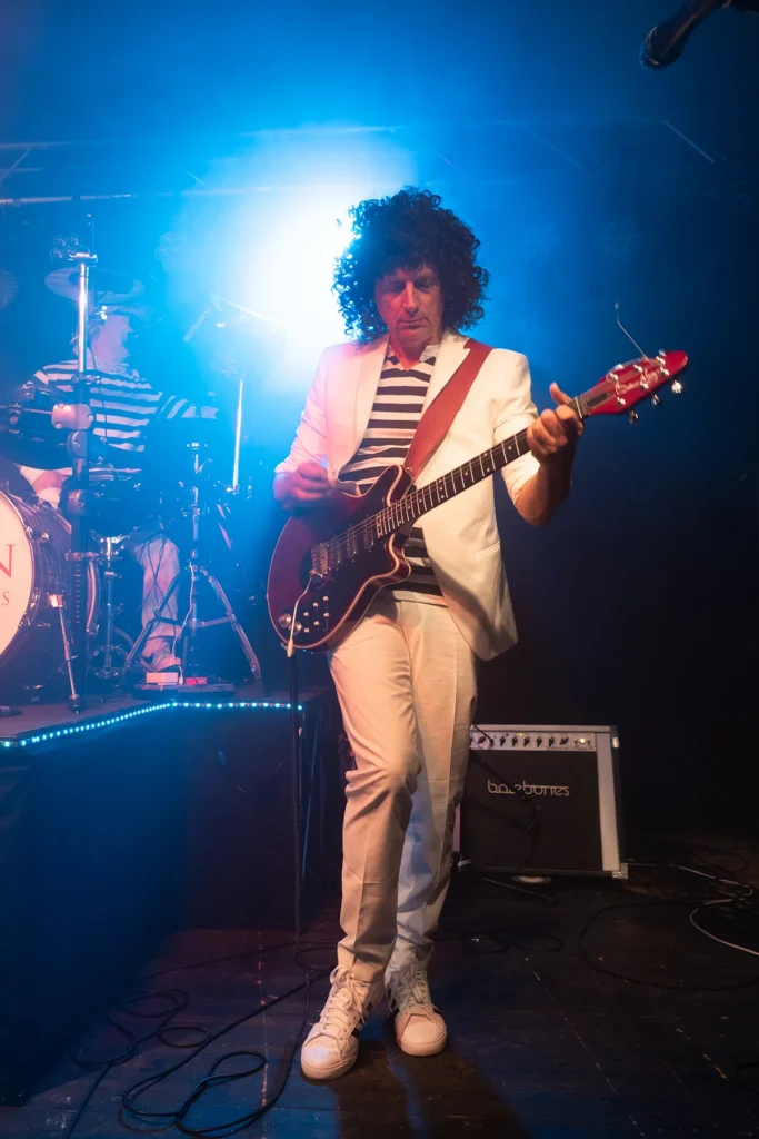 Matt of Queen Champions performing as Brian May on guitar