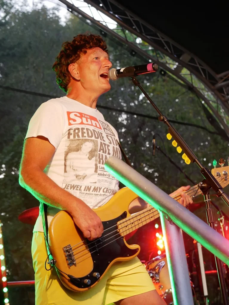 Stu of Queen Champions performing as John Deacon and singing live